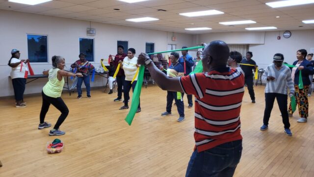 older adults participating in aerobic exercise, led my a fitness instructor